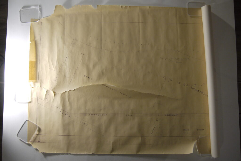 Rolled and torn map before conservation treatment